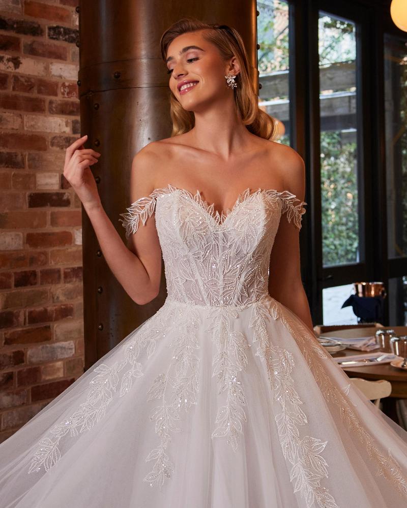 La22250 sparkly off the shoulder wedding dress with sleeves and a line silhouette3